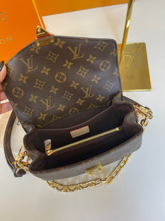 Pochette Metis East West Monogram